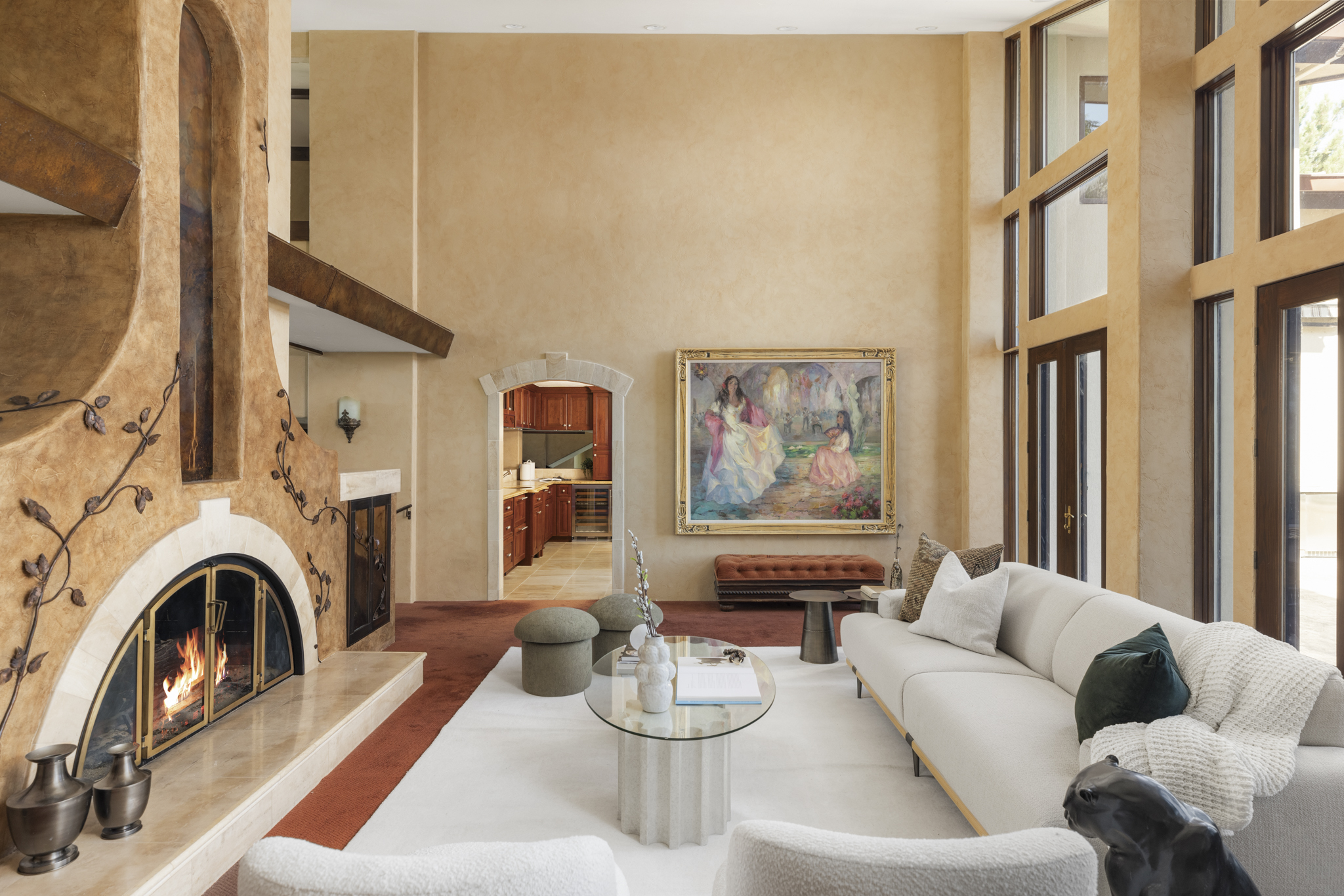 Great room with sculptural stone fireplace