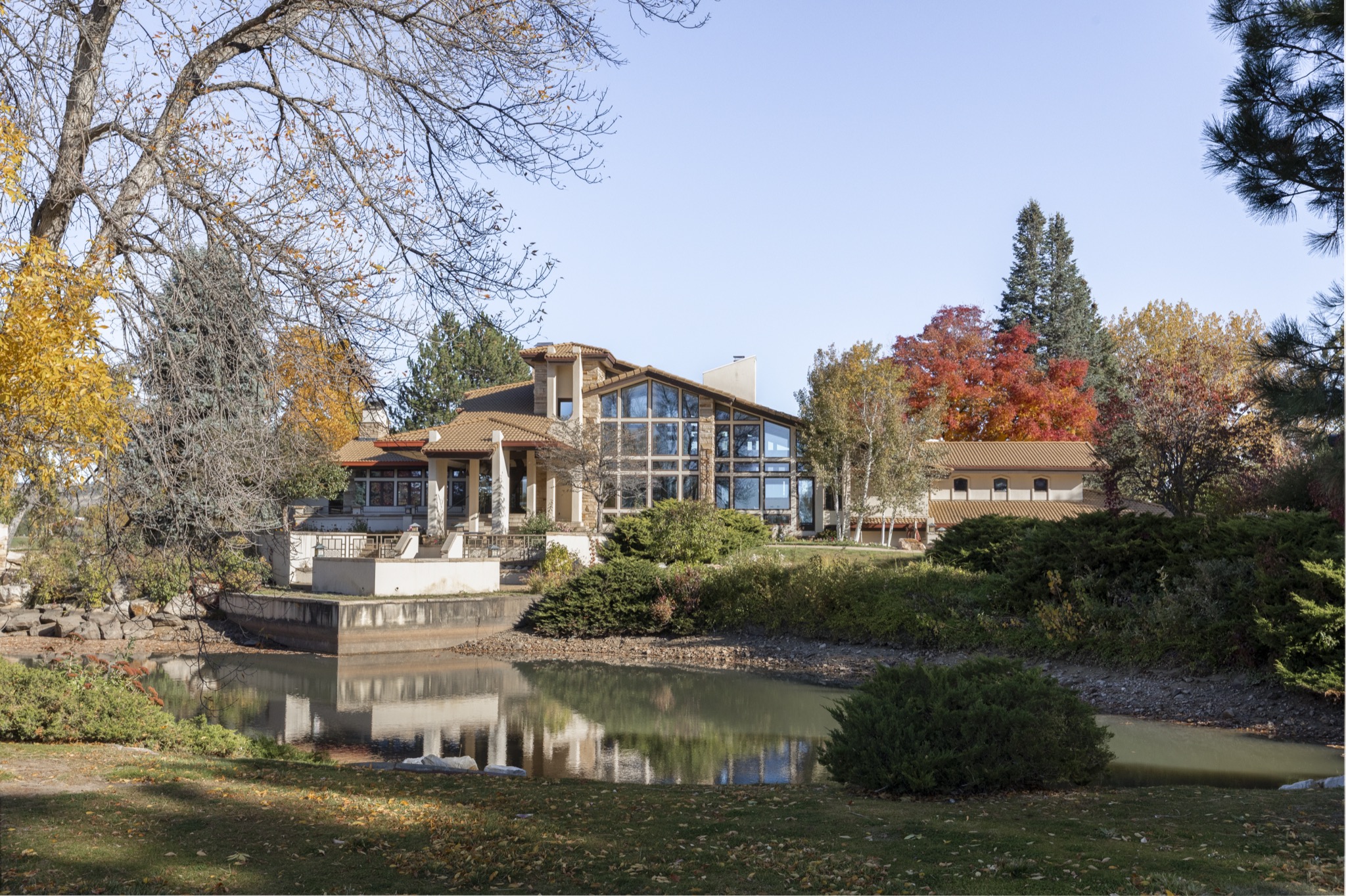 The residence reflected in the pond